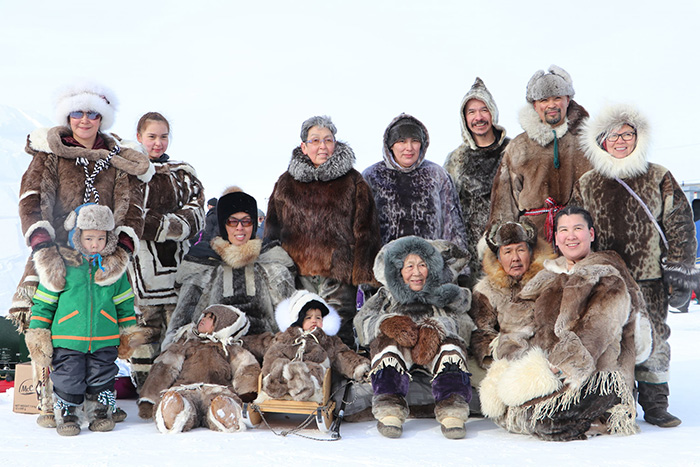 Attendees decked out in traditional clothing provided by Tukisigiarvik Society. Photo by Tristan Omik.